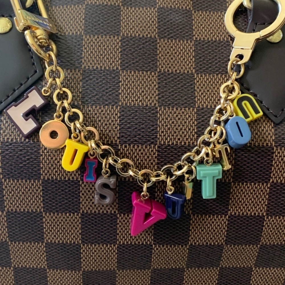 Louis Vuitton Playtime purse charm authentic firm